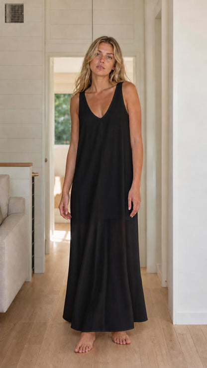 Front view of woman wearing black sleeveless maxi dress