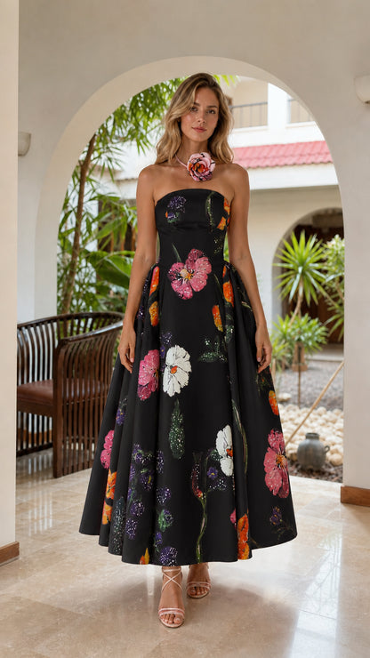 Model wearing black floral strapless midi dress