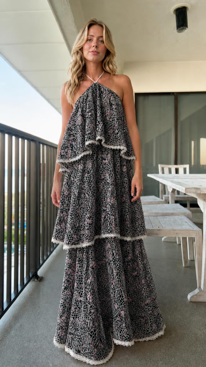 Model wearing black tiered halter lace maxi dress