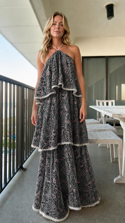 Model wearing black tiered halter lace maxi dress