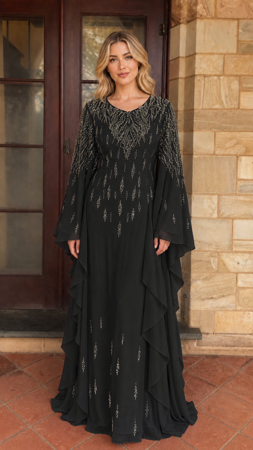 Model wearing black beaded long sleeve maxi dress