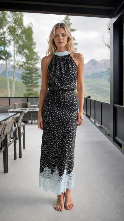 Front view of black printed halter neck maxi dress