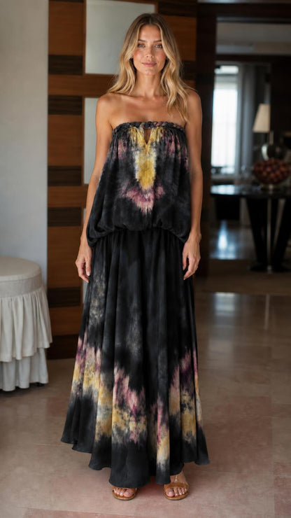 Model wearing black tie-dye strapless maxi dress
