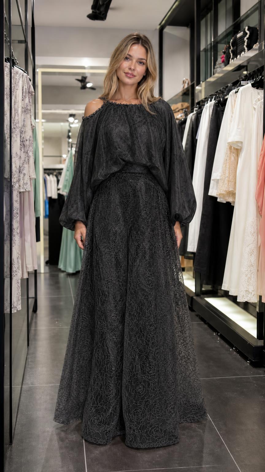 Model wearing black two-piece set