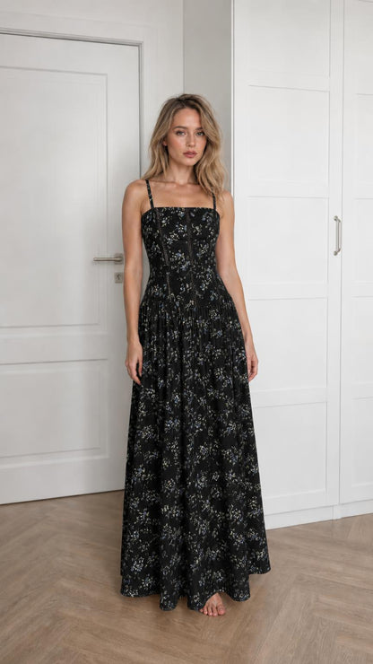 Front view of woman wearing black floral maxi dress