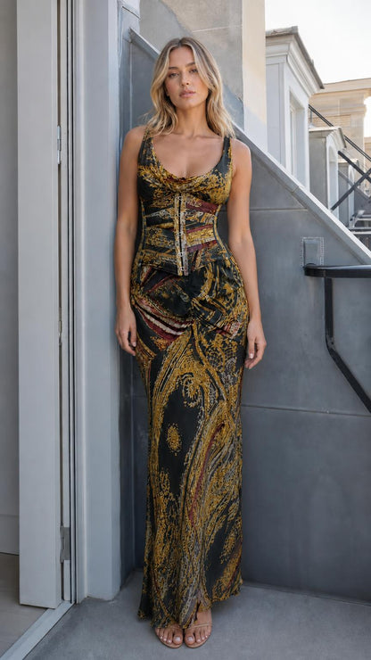 Front view of model wearing black printed corset maxi dress