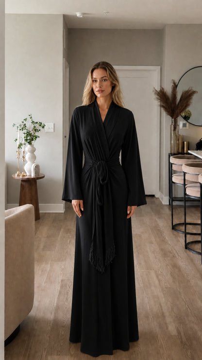 Full-length view of model in black maxi wrap dress