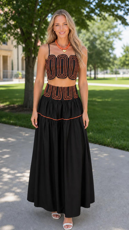 Front view of woman wearing black embroidered two-piece set
