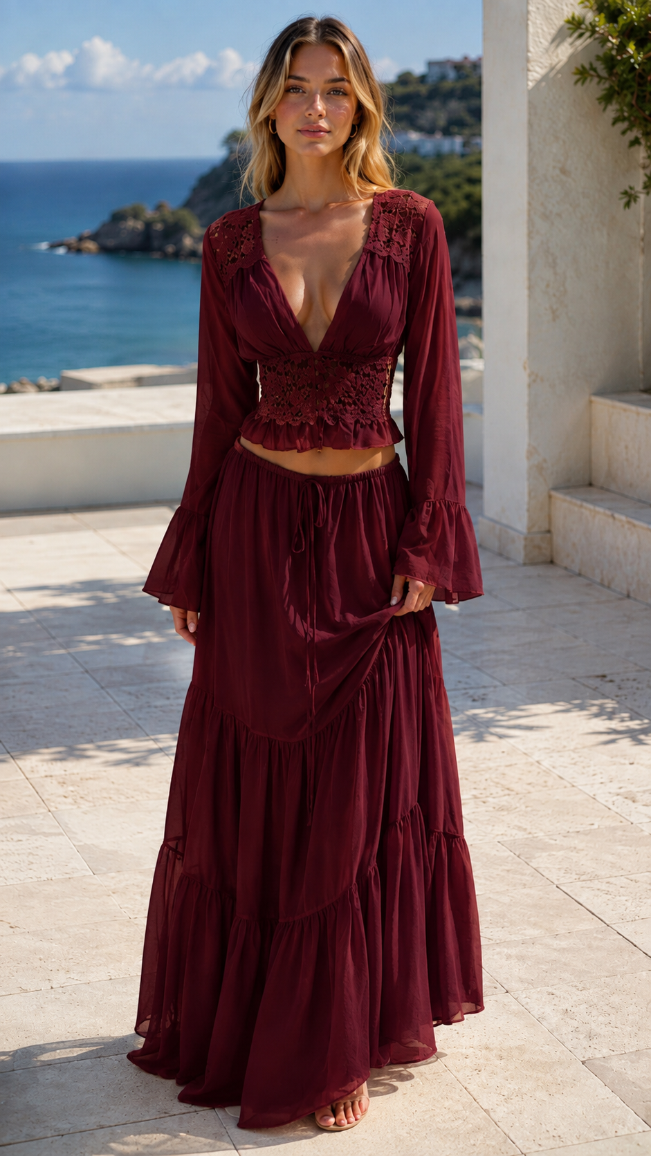 Model wearing burgundy boho lace crop top and tiered maxi skirt set