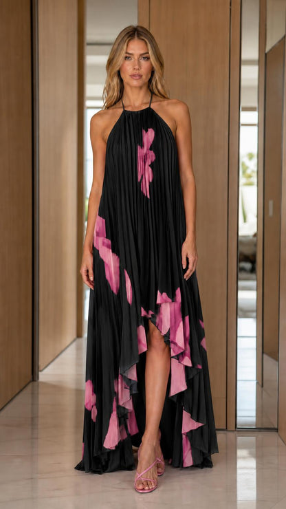 Front view of woman wearing black pleated halter maxi dress