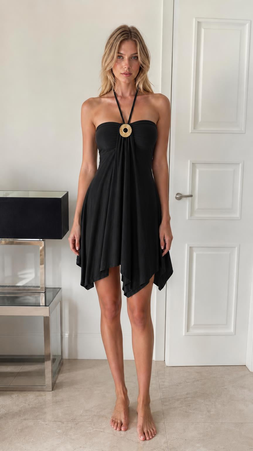 Front view of model wearing black halter mini dress