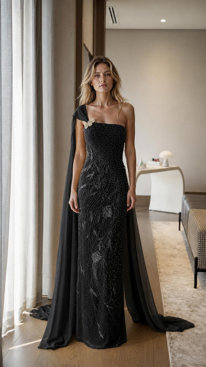 Front view of black one-shoulder beaded evening gown