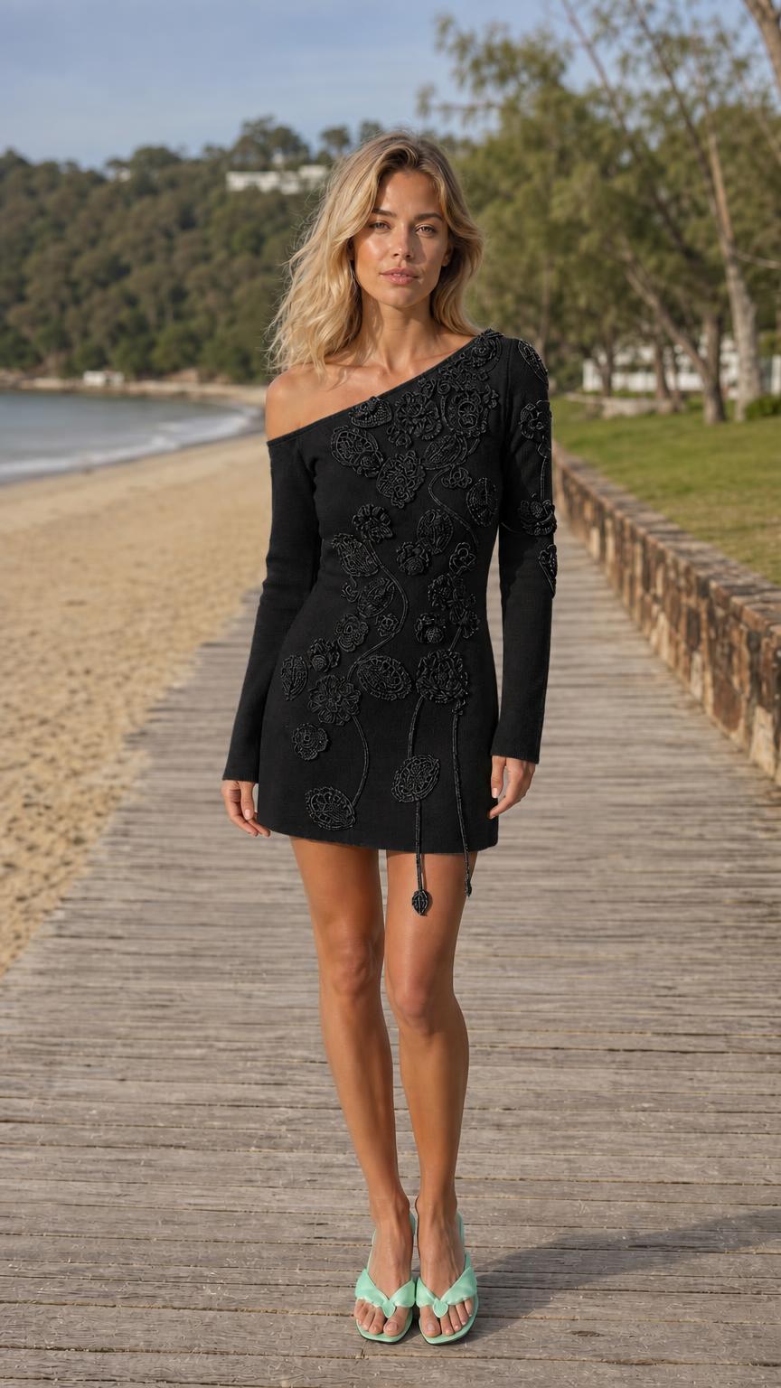 Front view of model wearing Black one-shoulder knit mini dress