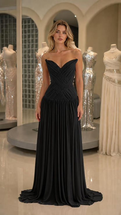Front view of black pleated strapless evening gown