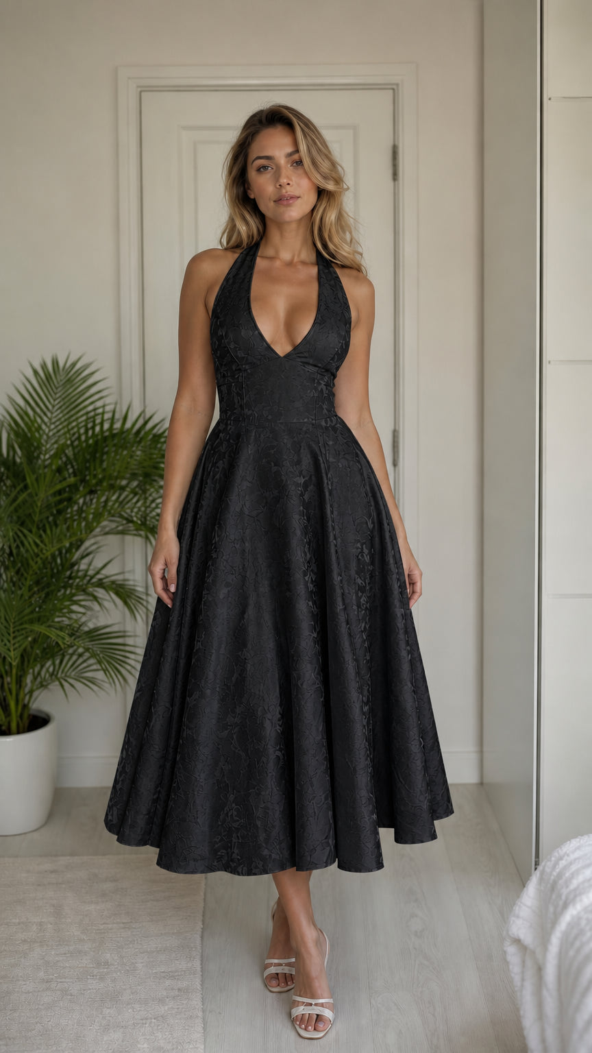 Model wearing black halter midi dress