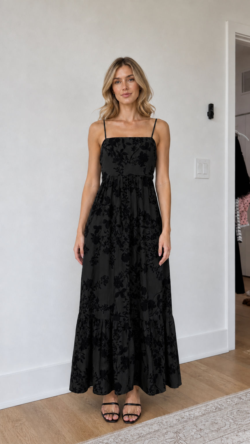 Model wearing black floral maxi dress