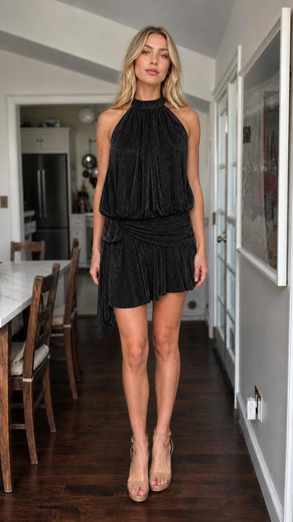 Model wearing black metallic halter mini dress