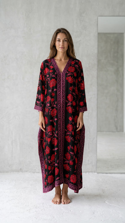 Front view of model wearing black floral long kaftan maxi dress