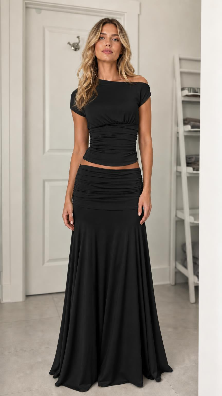 Model wearing black ruched two-piece set