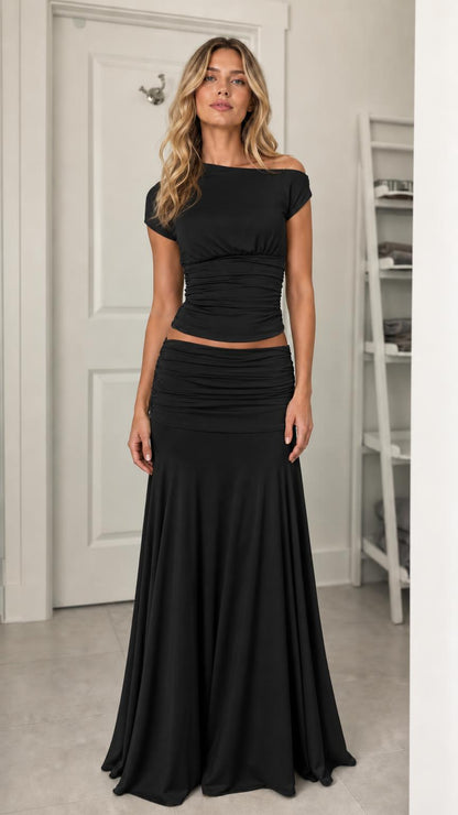 Model wearing black ruched two-piece set