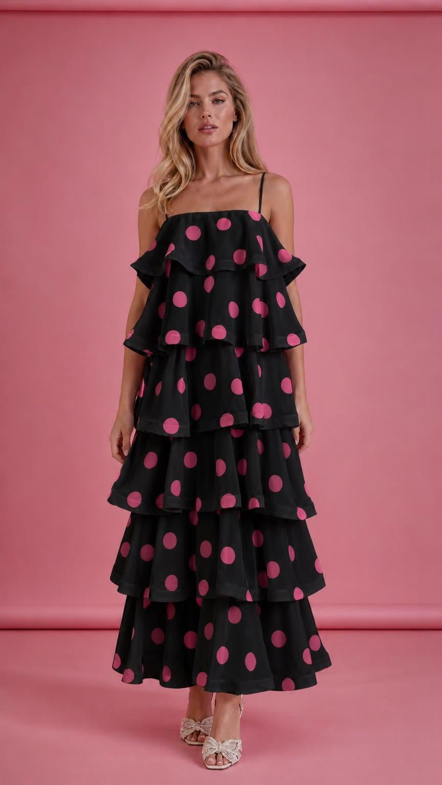 Model wearing black polka dot tiered ruffle midi dress