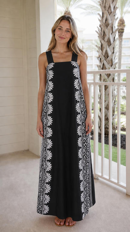 Woman wearing black maxi dress with side print panels