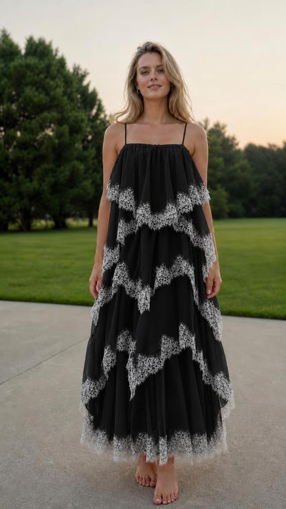 Front view of model wearing black tiered tulle maxi dress