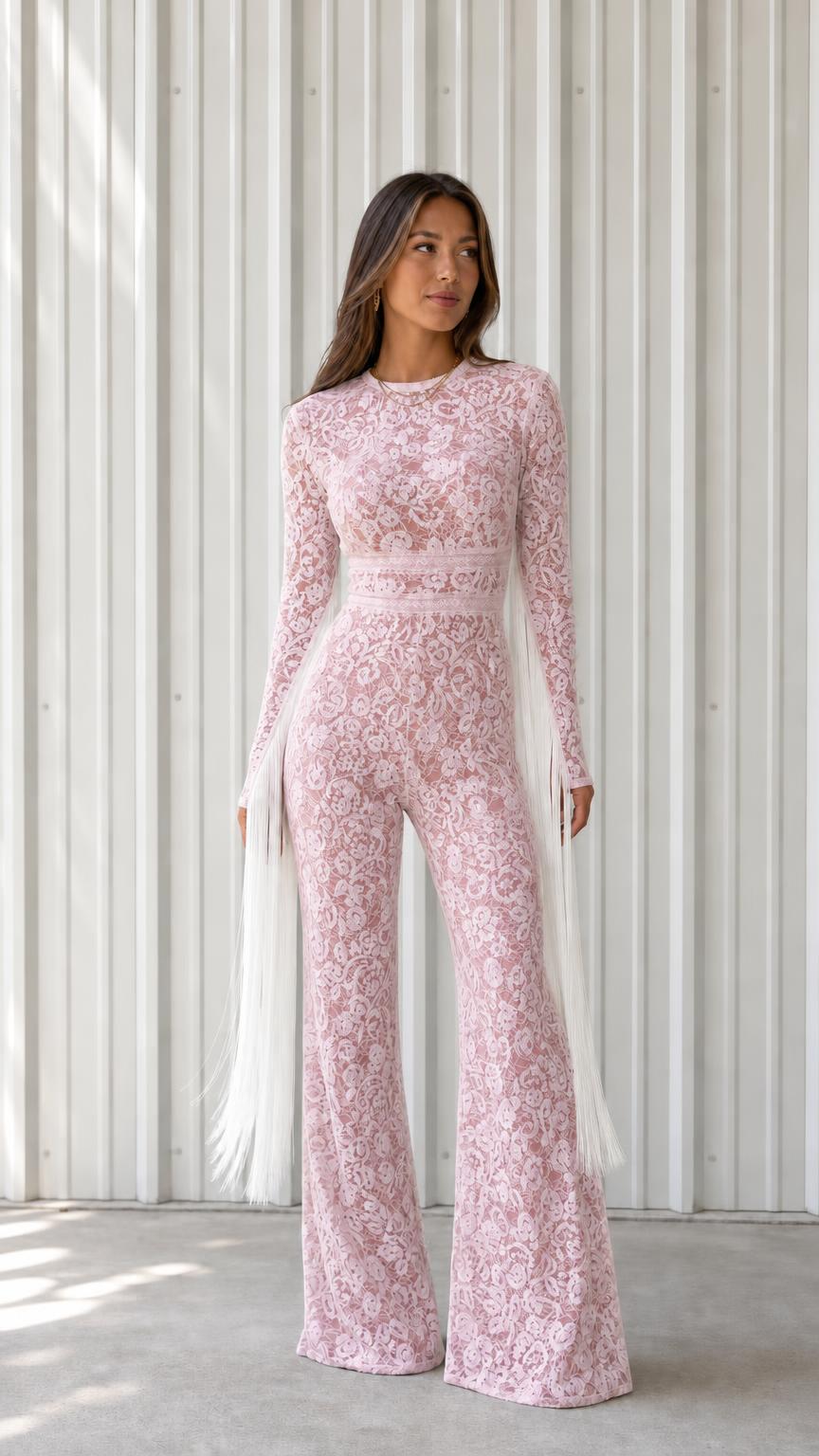 Front view of woman wearing pink lace long sleeve wide leg jumpsuit