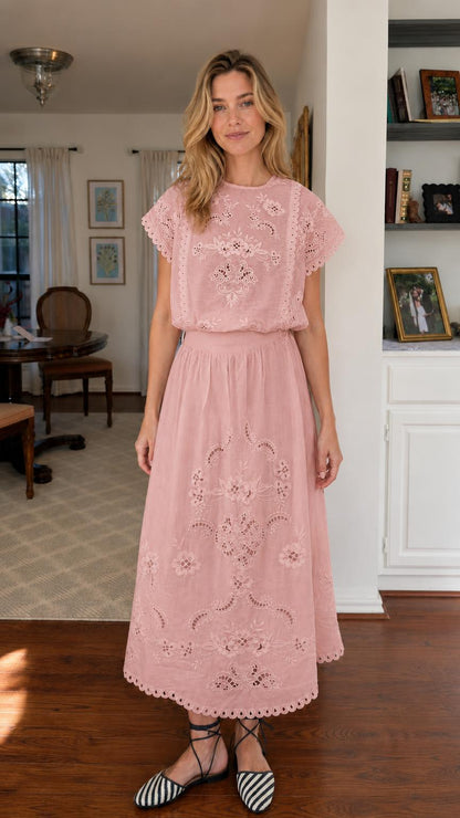Woman wearing pink embroidered short sleeve midi dress