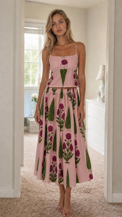 Woman wearing pink floral print cami top and midi skirt set
