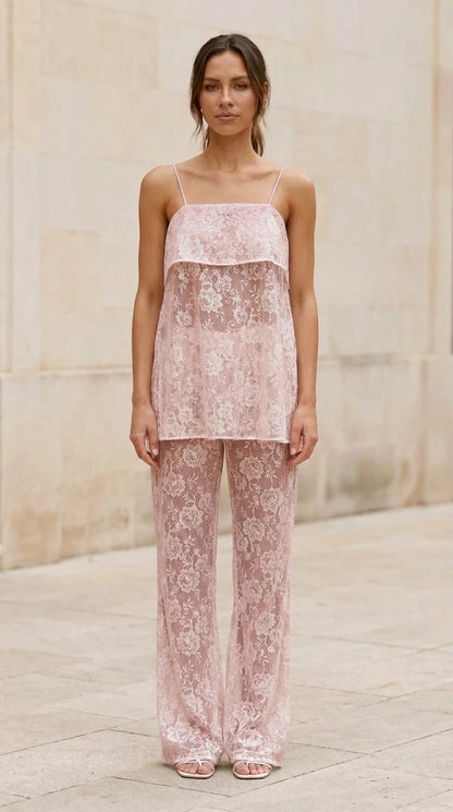 Model wearing pink lace cami top and matching pants