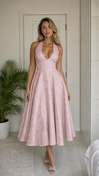 Model wearing pink halter midi dress