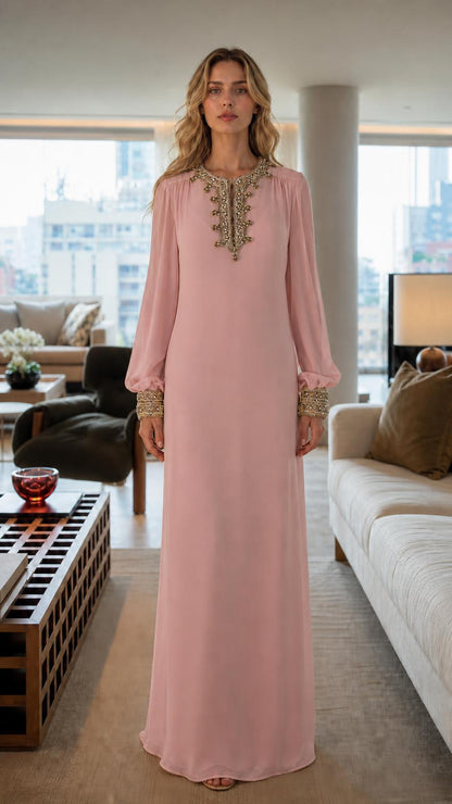 Front view of woman wearing pink embroidered long sleeve maxi dress