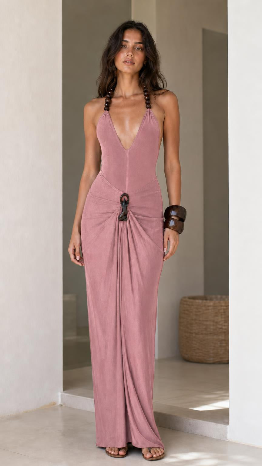 Model wearing dusty pink halter maxi dress