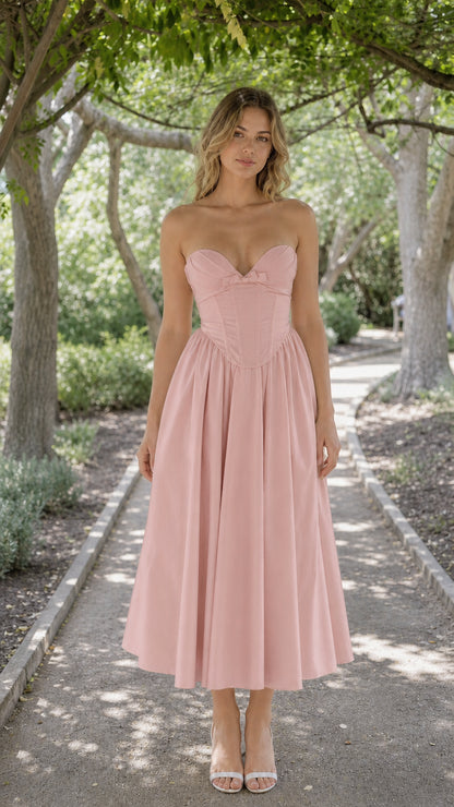 Front view of woman wearing pink strapless corset midi dress
