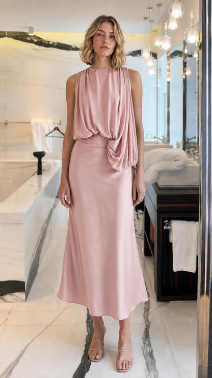 Front view of woman wearing Pink draped midi dress