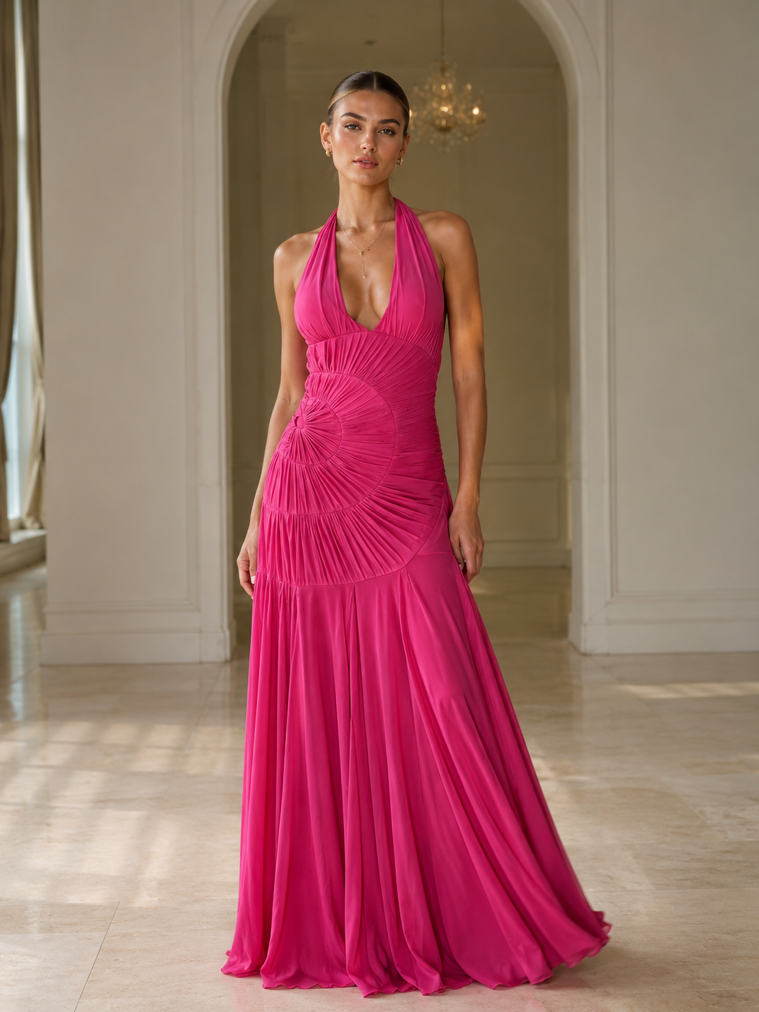 Full-length front view of hot pink pleated halter evening dress