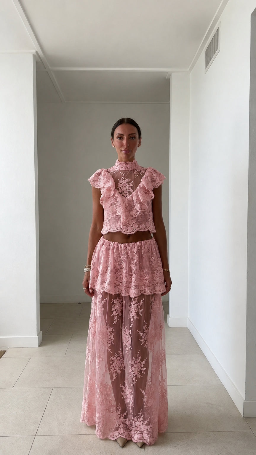 Model wearing pink lace two-piece set