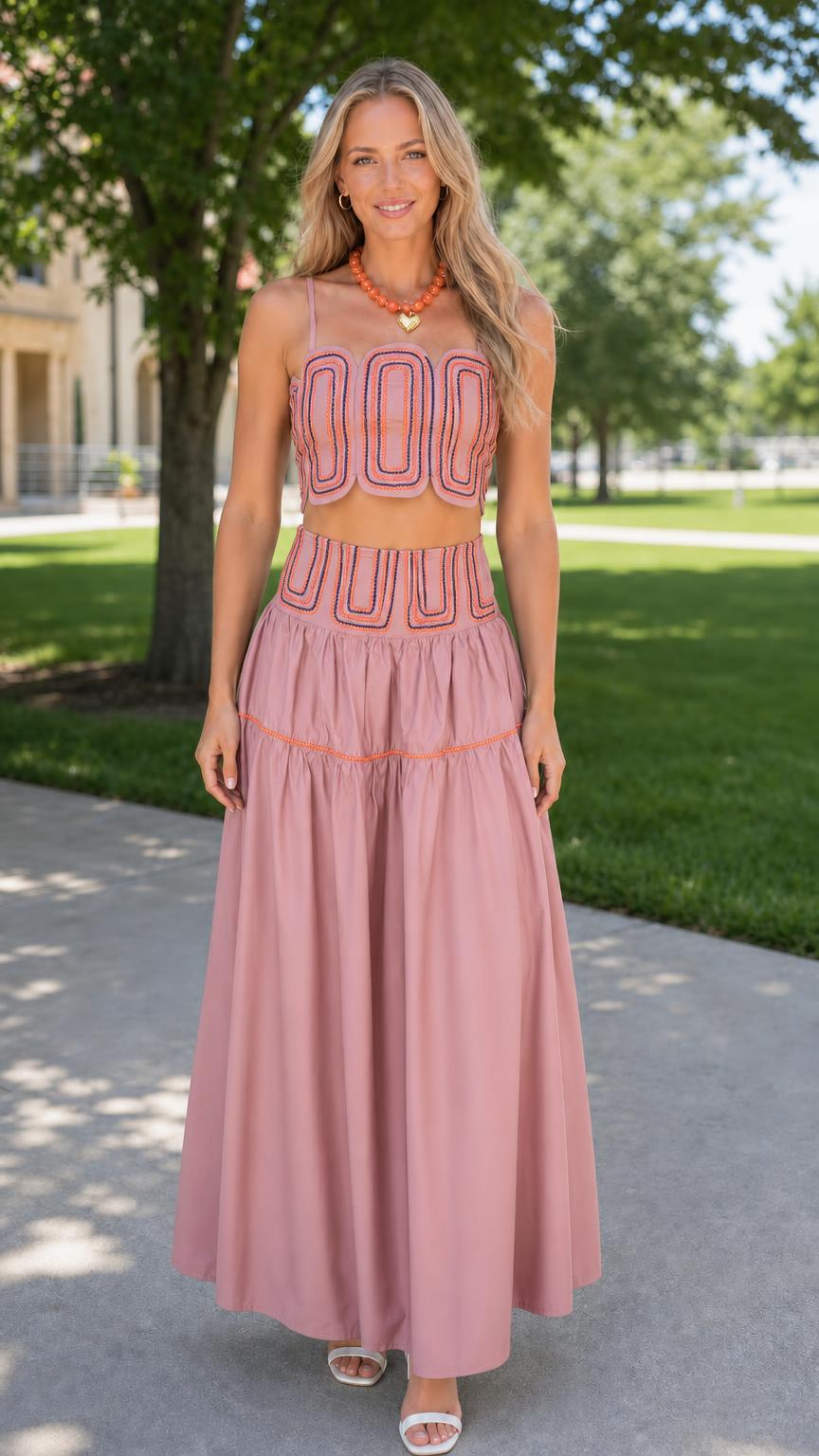 Front view of woman wearing dusty pink embroidered two-piece set