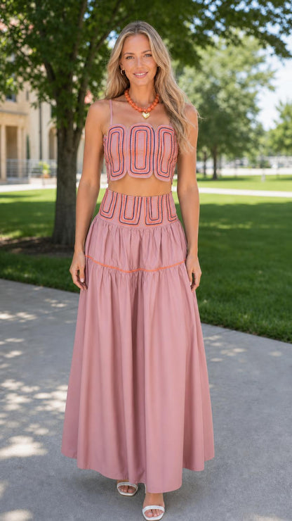 Front view of woman wearing dusty pink embroidered two-piece set