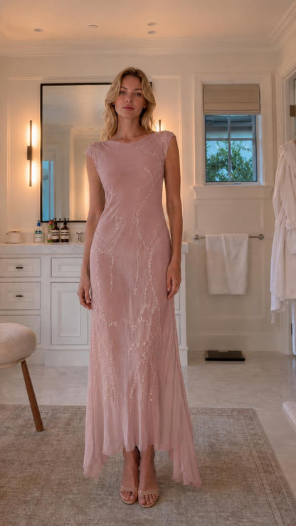 Front view of model wearing blush sequin maxi dress