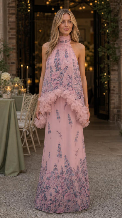Model wearing pink floral print ruffled halter maxi dress