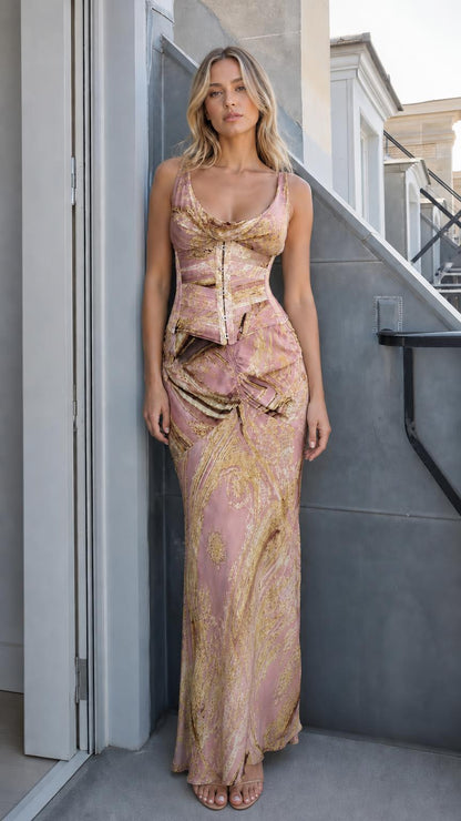Front view of model wearing pink printed corset maxi dress