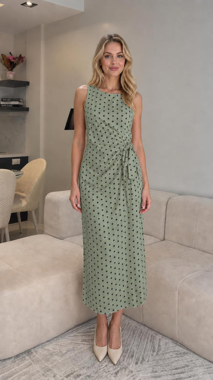 Front view of sage polka dot midi dress