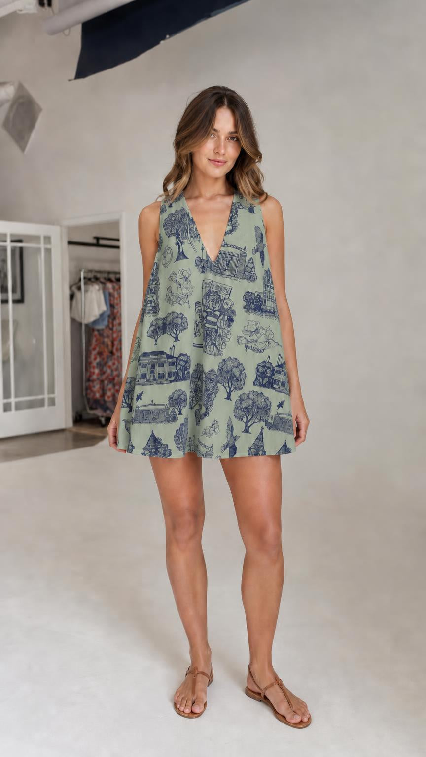 Model wearing green Toile print mini dress