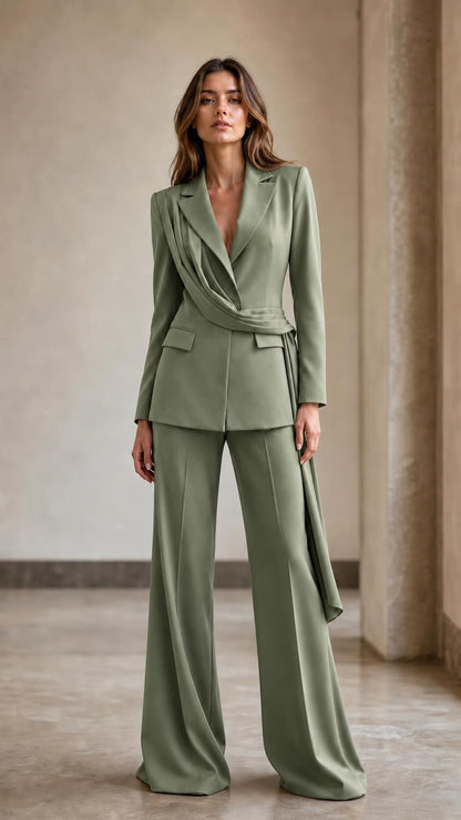 Front view of woman wearing sage green draped blazer and wide-leg pants suit