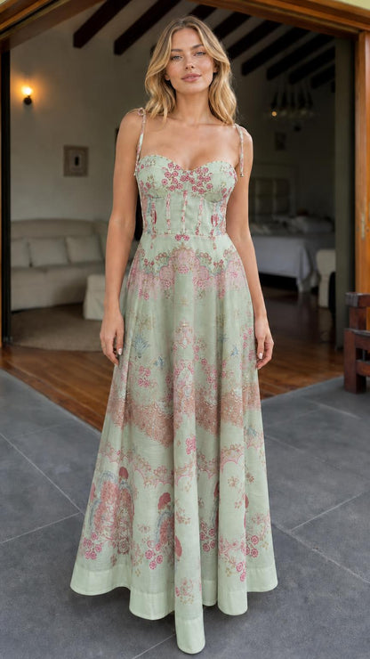 Model wearing sage green floral print corset maxi dress
