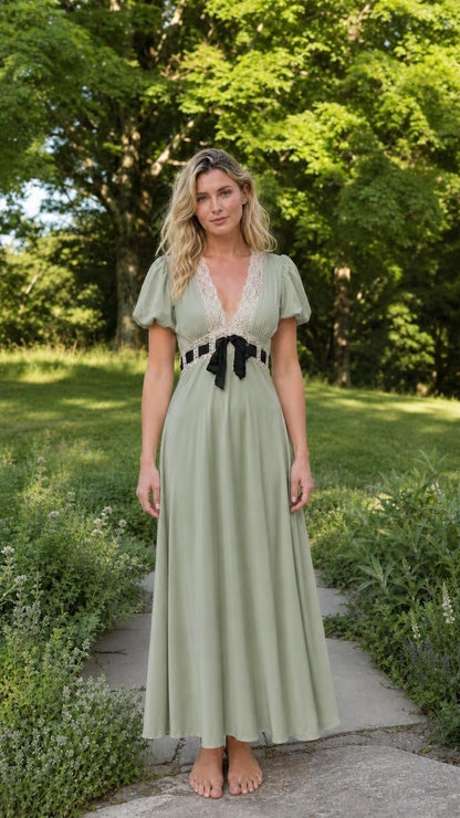 Front view of woman wearing sage green V-neck lace trim maxi dress