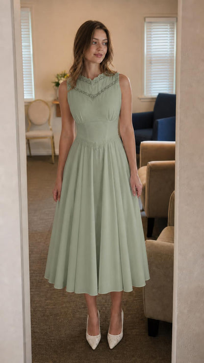 Front view of model wearing sage green lace trim midi dress