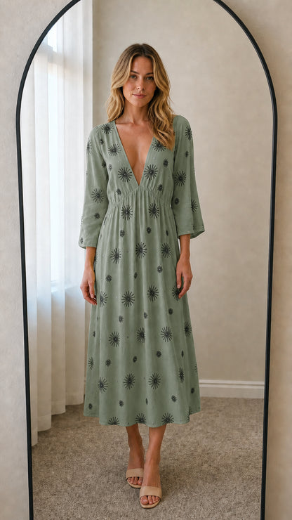Front view of sage green embroidered midi dress